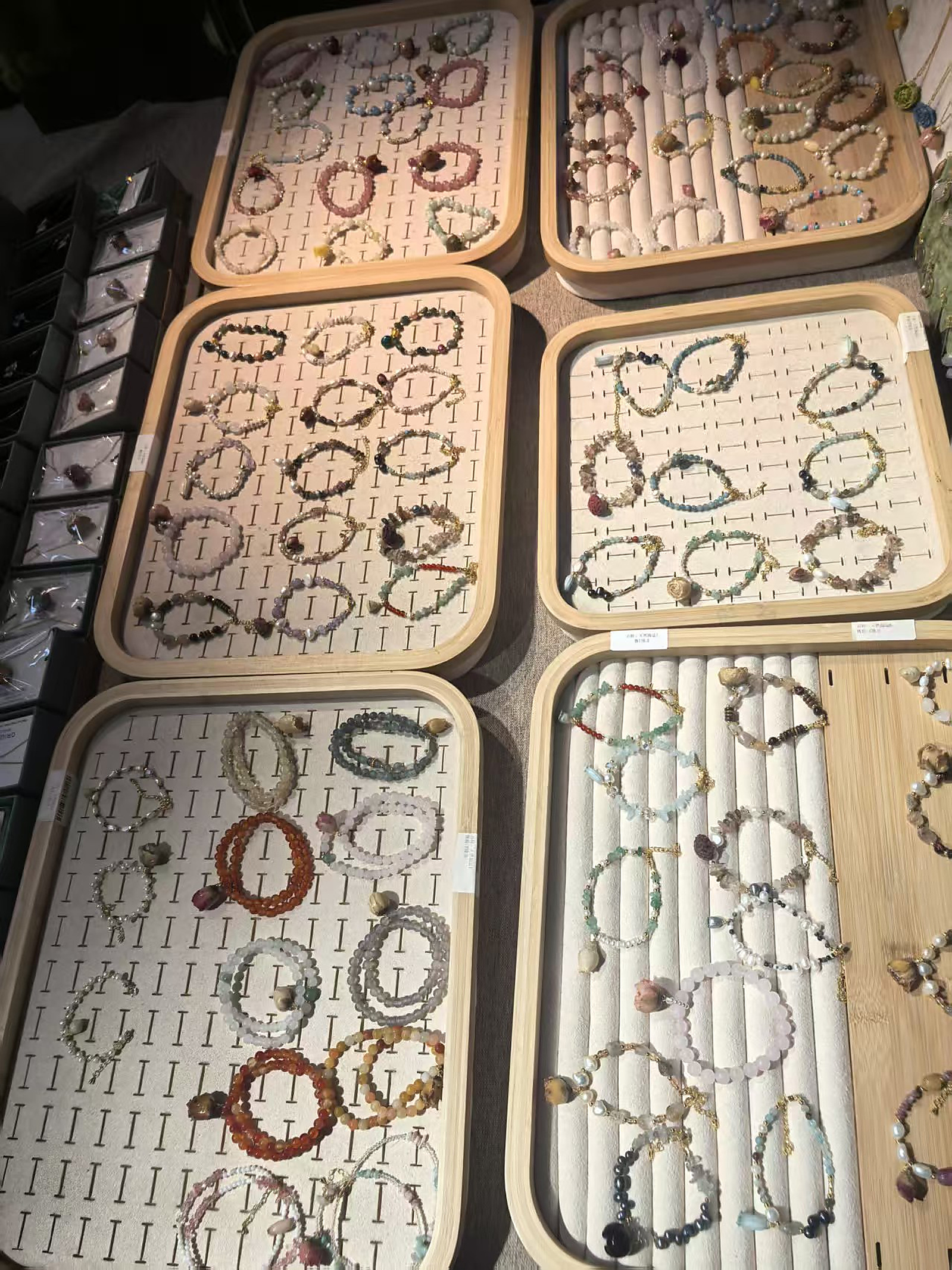 Real wholesale trays filled with mixed crystal bracelets and charm bracelets
